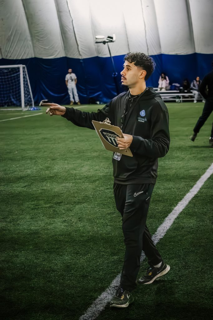Mohammad Shamkhi supporting youth players at the InTouch Football Pro Combine Toronto