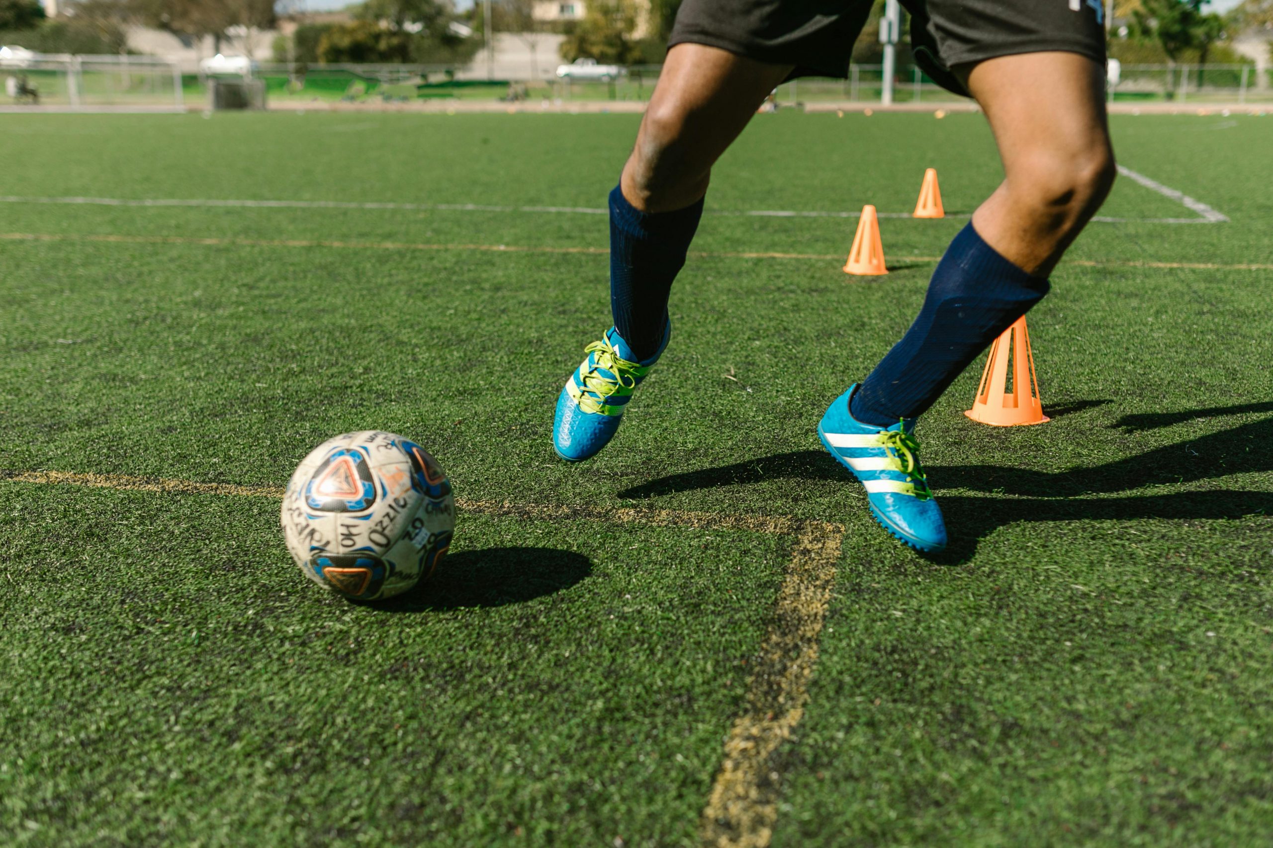 Youth soccer player practicing at home with soccer training equipment