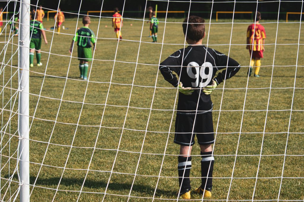 High intensity youth soccer match action showing the competition for playing time in high level sports.
